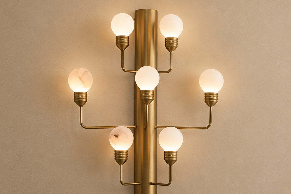 Natural brass and alabaster wall sconce mounted on an interior wall