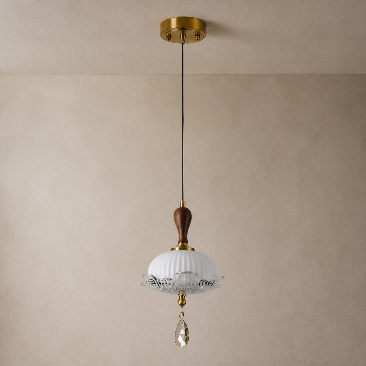 Valloren Ribbed Glass and Walnut Pendant Light on a warm neutral wall-top background