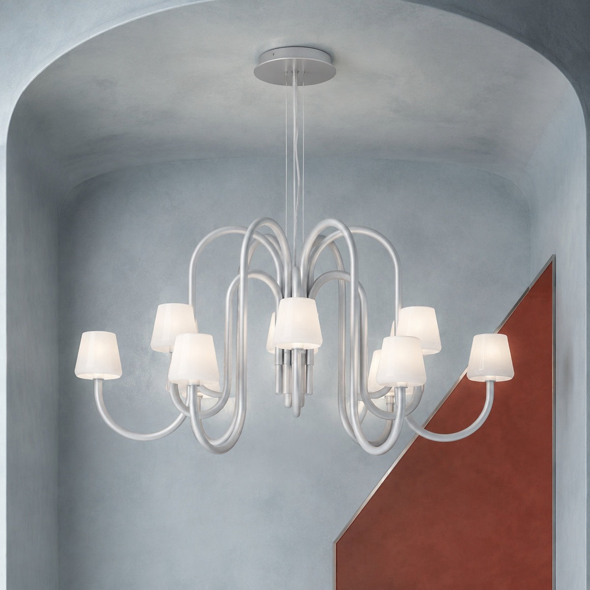 Apollo twelve-light gray aluminum and opal glass chandelier fully suspended from a solid ceiling