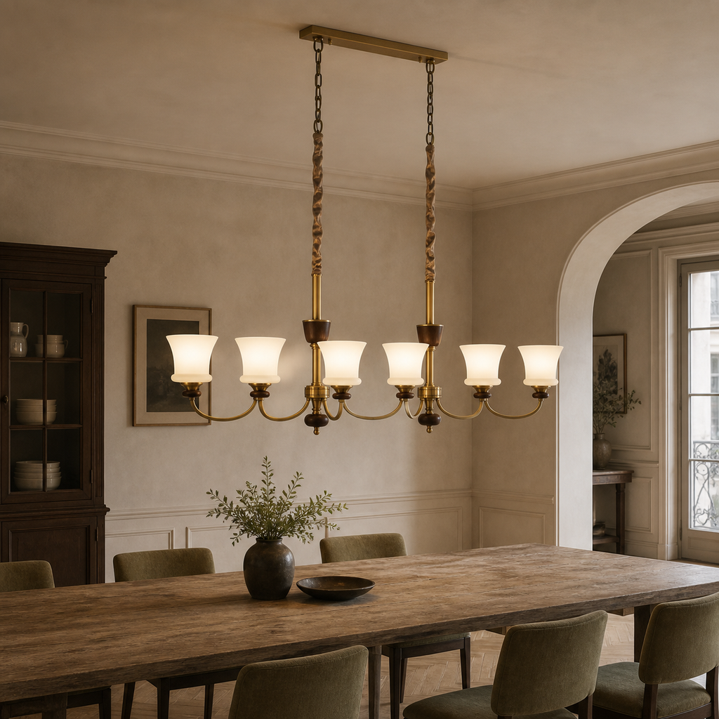 Caldrienne six-light linear chandelier illuminated above a dining table