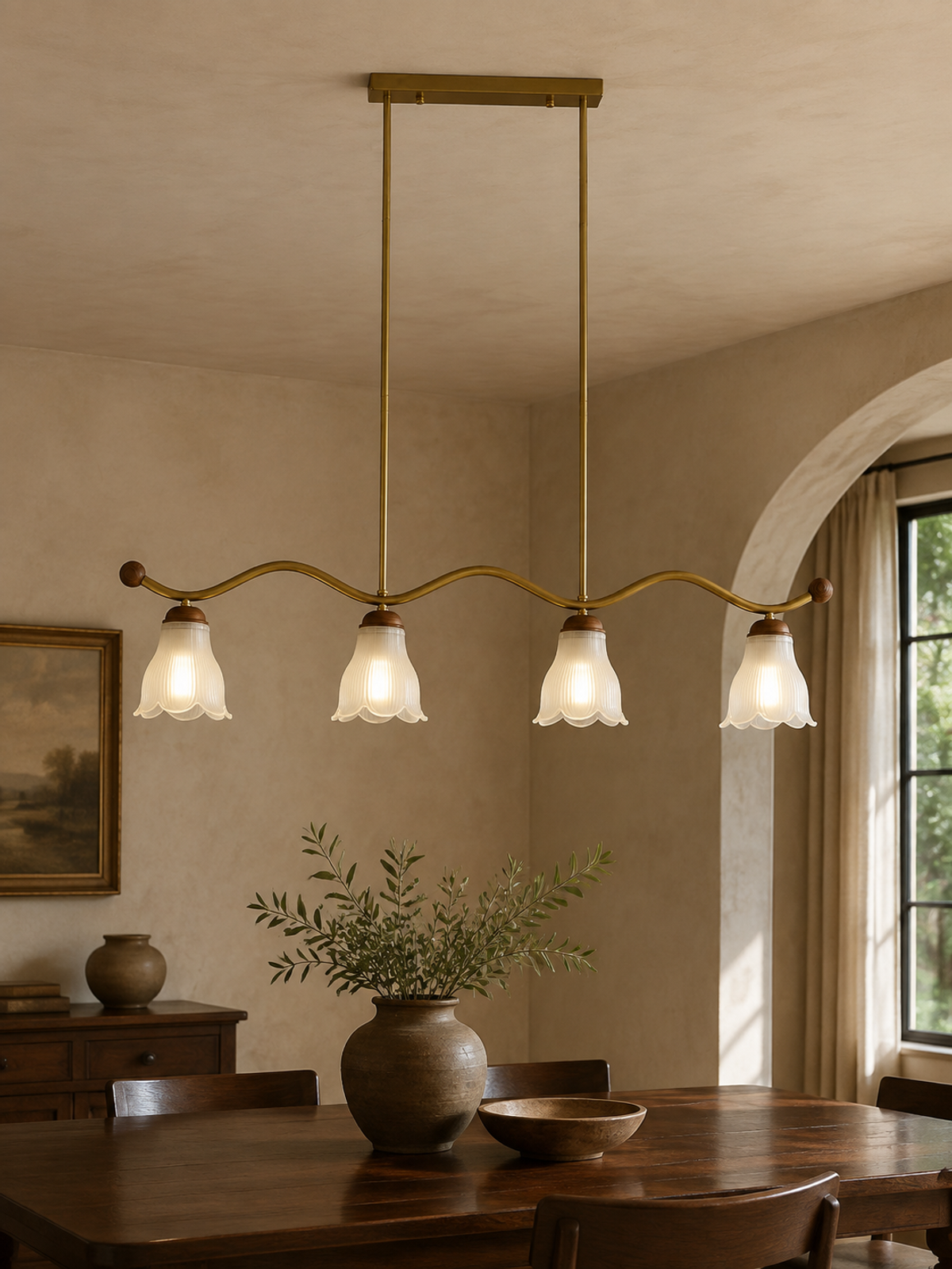 Cloveraine four-light fluted petal glass linear chandelier centered above a walnut dining table