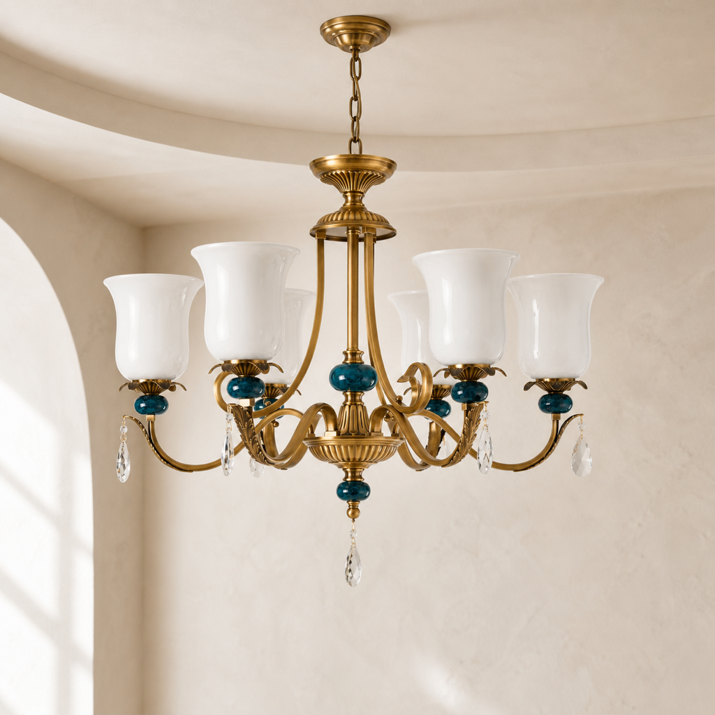 Marcelline antique brass and teal glass chandelier in a warm neutral room