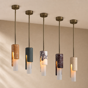Modern Slim Stone Cylinder Pendant Light in five finish options, installed against a warm beige ceiling