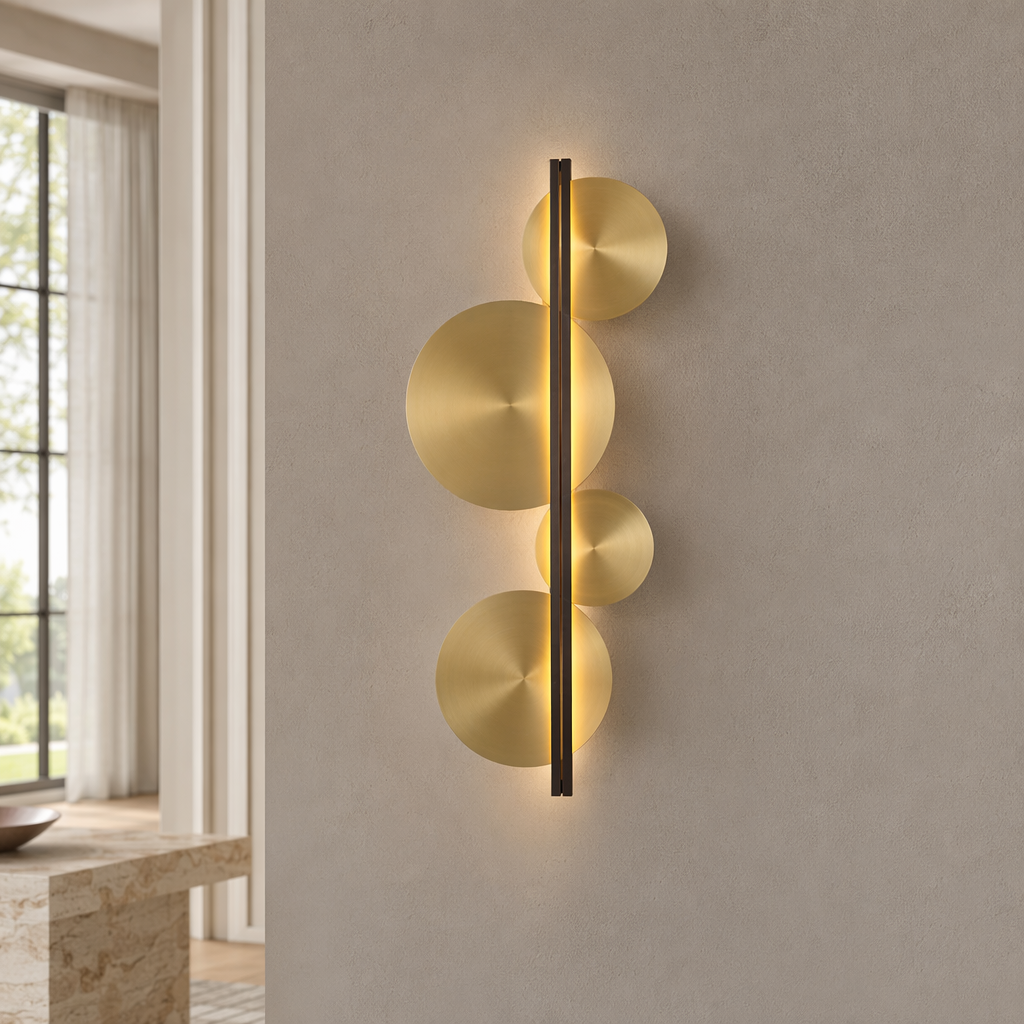 Brass Disc LED Wall Sconce product view on a warm neutral background