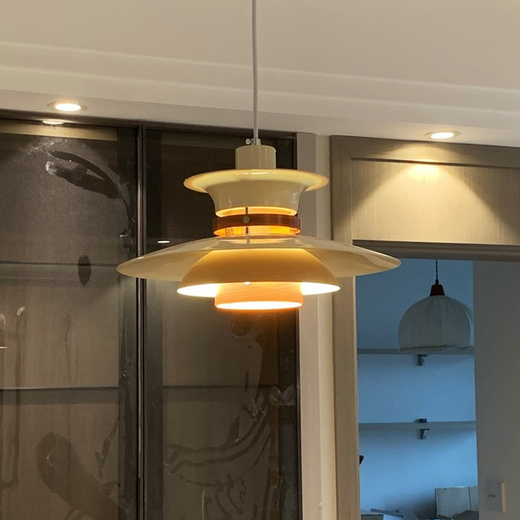 Layered Aluminum and Walnut Pendant Light — illuminated layered reflector detail