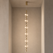 Royal vertical brushed copper LED pendant fully suspended from a solid ceiling