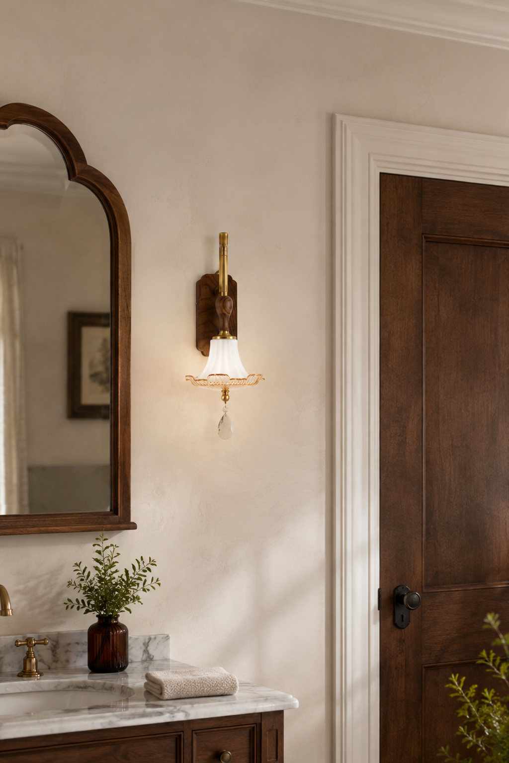 Virdelune fluted bell glass wall sconce illuminated in a warm residential interior