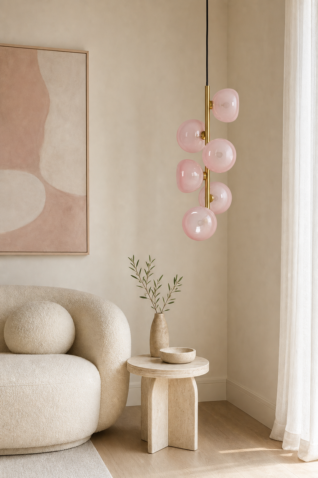 Blush glass six-light vertical pendant in Natural Brass in a bright modern living room