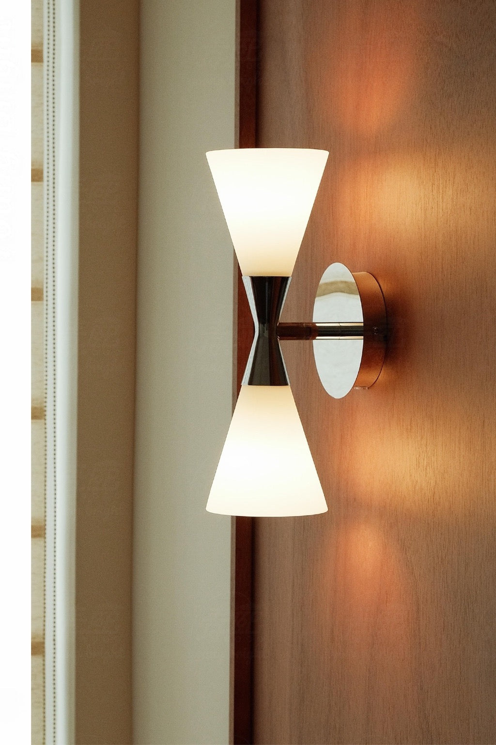 Harlekin Duo Wall Sconce polished chrome installed wood-wall scene