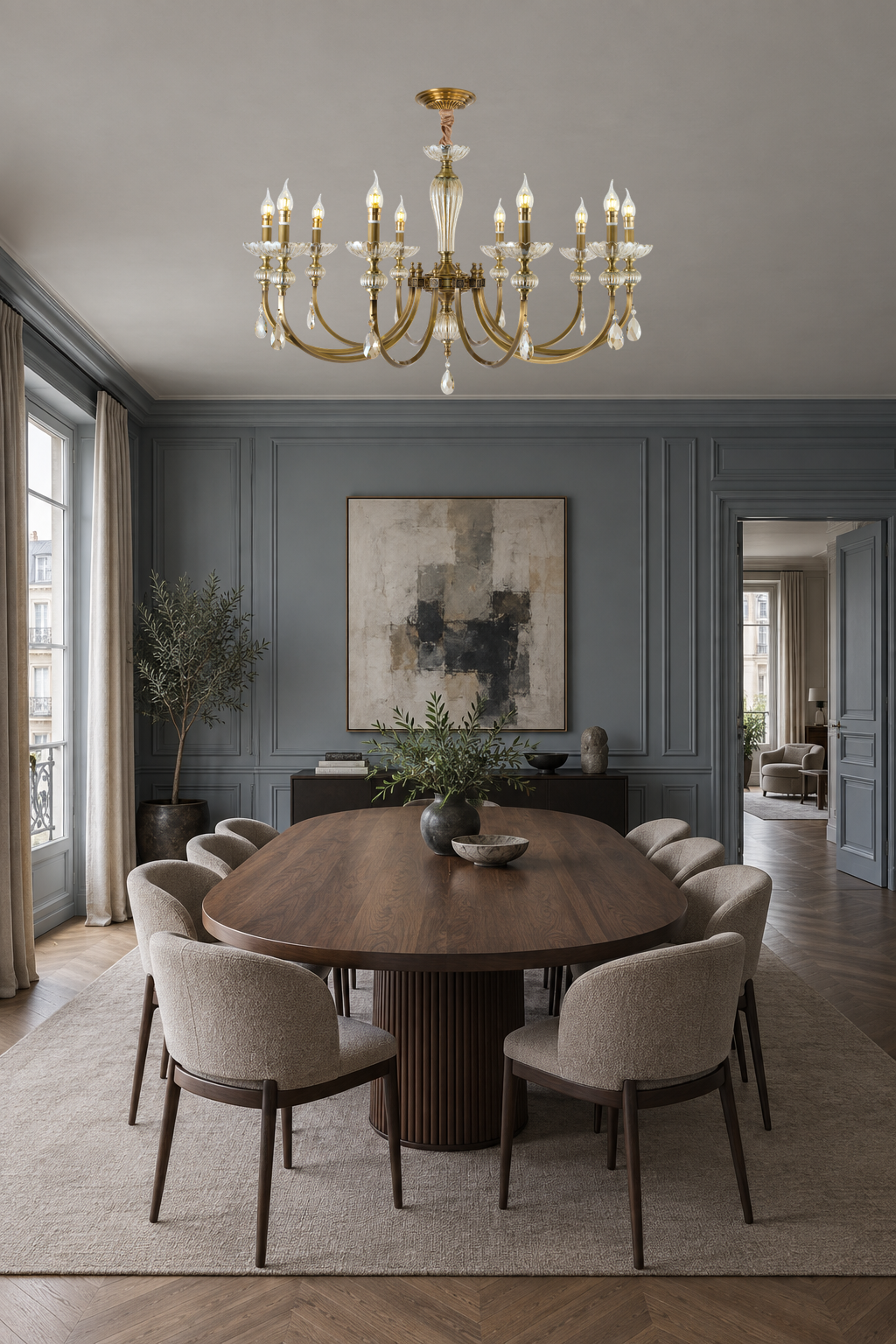 Lucerayne ten-light chandelier centered above a long oval walnut table in a slate-blue gallery dining room