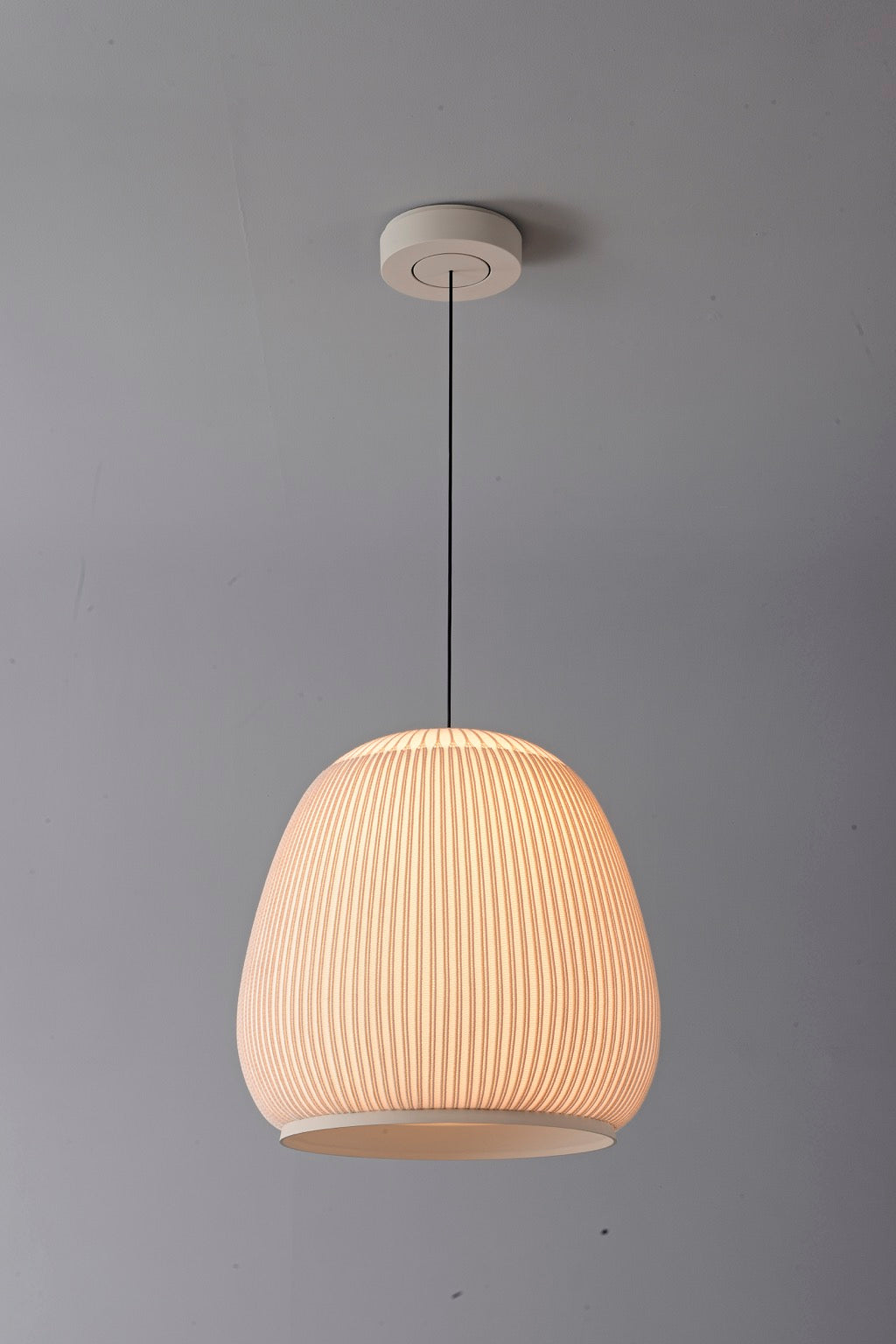 Modern Ribbed Dome Pendant Light — complete tall shade illuminated