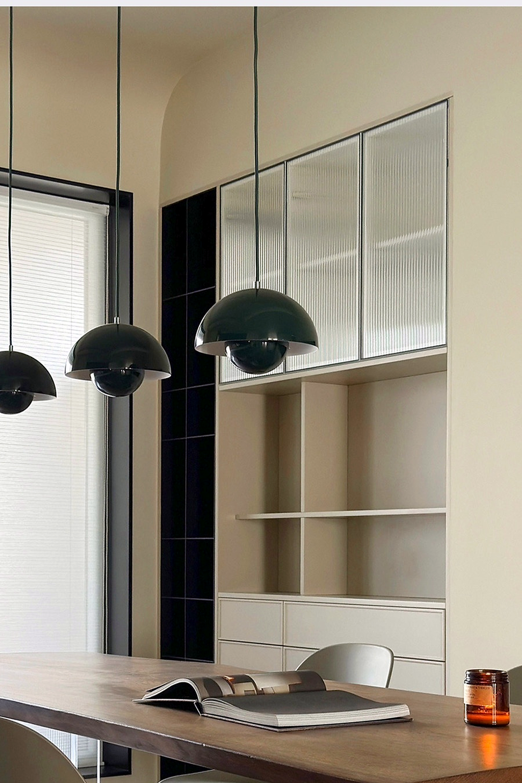Black Flowerpot Dome Pendant Lights above a dining table