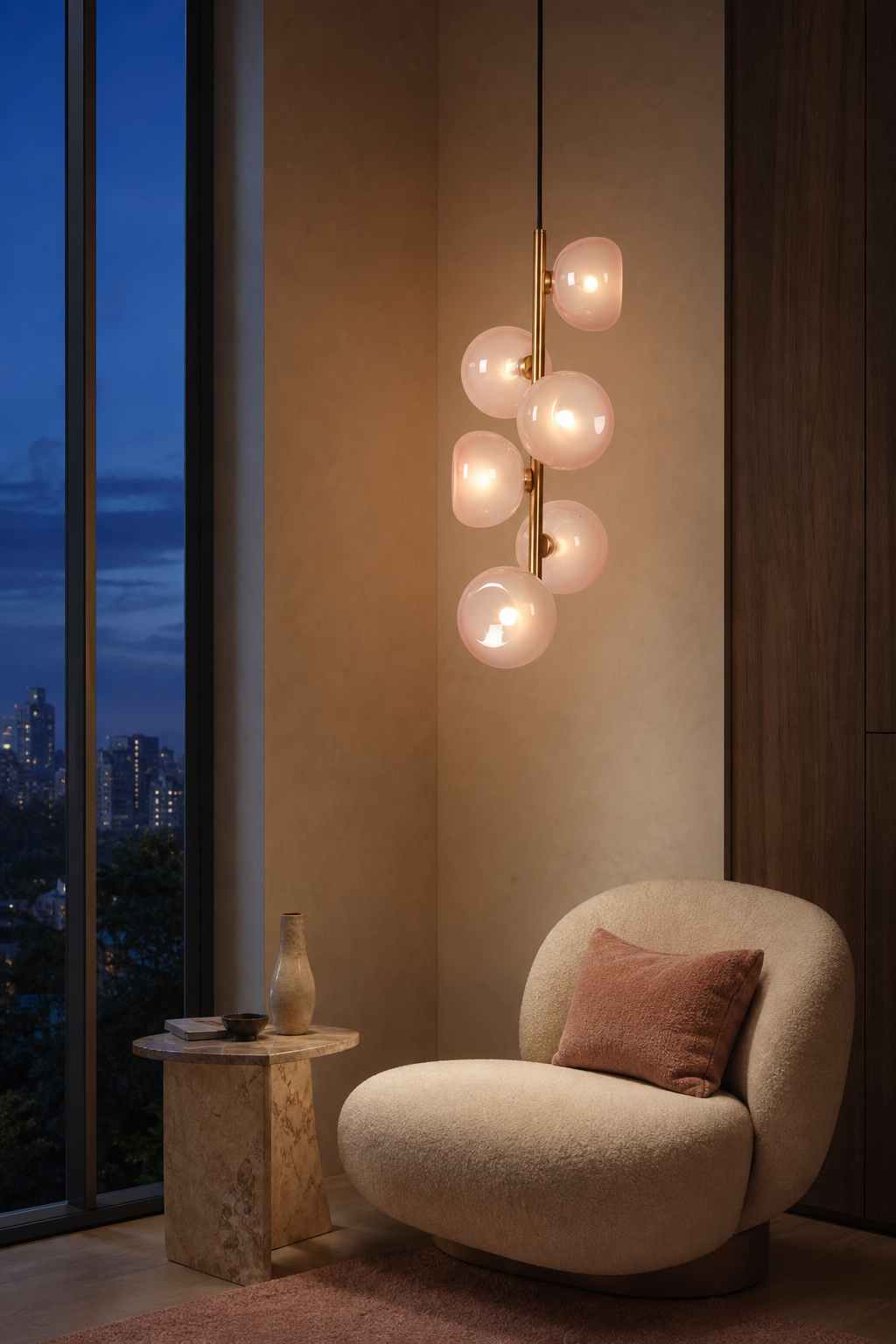 Blush glass six-light vertical pendant illuminated in a warm modern lounge