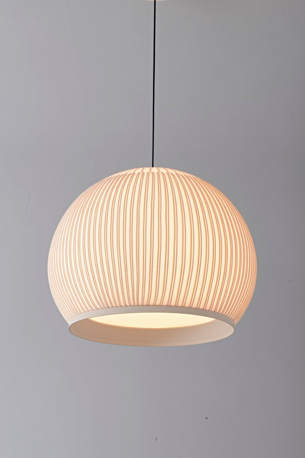 Modern Ribbed Dome Pendant Light — illuminated rounded shade detail