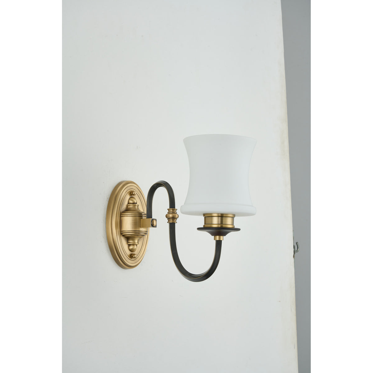 Supplier real photograph of the unlit Ebonelle one-light wall sconce complete front view