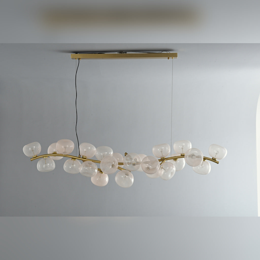 Clear glass 26-light linear chandelier in Natural Brass, unlit front product view