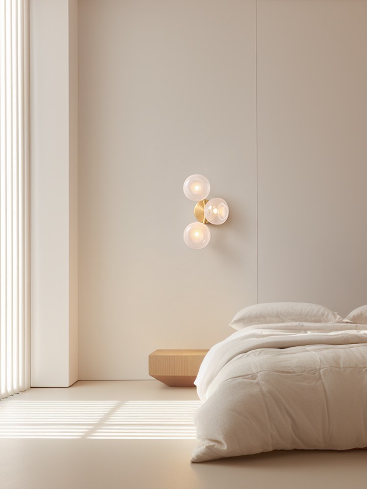 Modern Glass Globe Branch Wall Sconce in Natural Brass - 03 03-scene-natural-brass-glass-globe-wall-sconce-bedroom