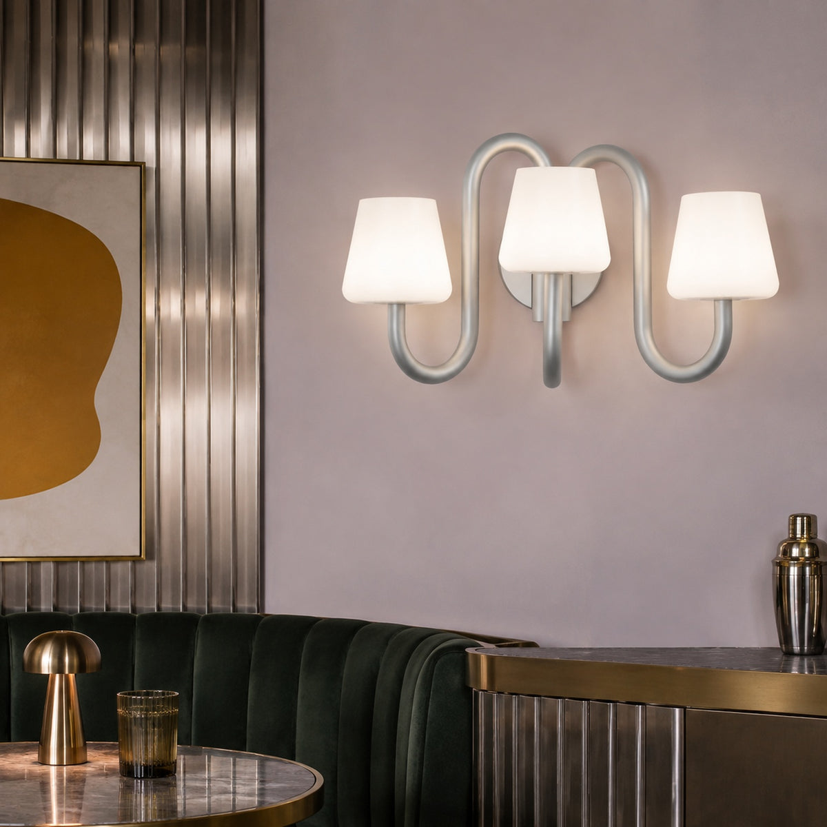 Apollo three-light wall sconce in a lilac and stainless steel designer dining nook
