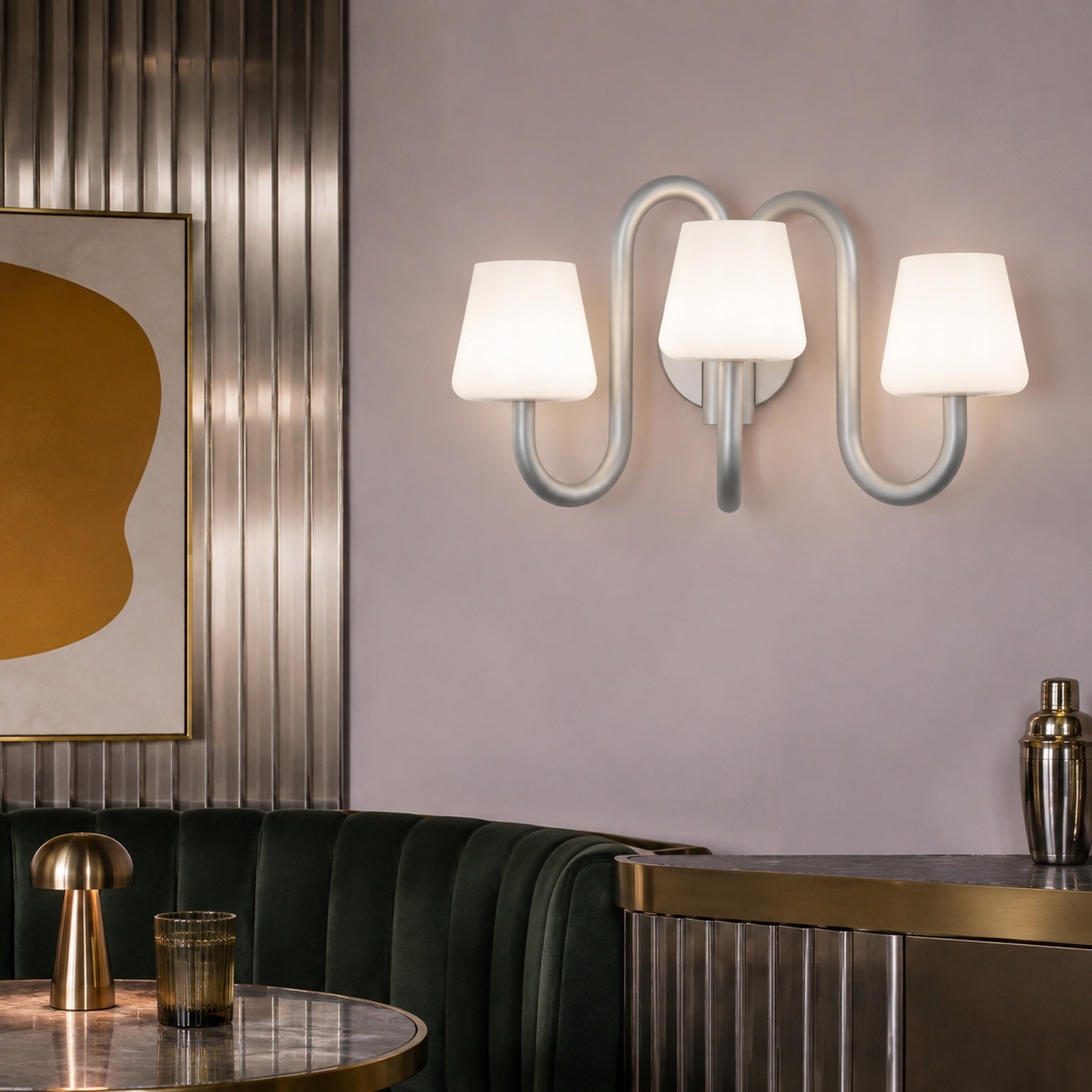 Apollo three-light wall sconce in a lilac and stainless steel designer dining nook