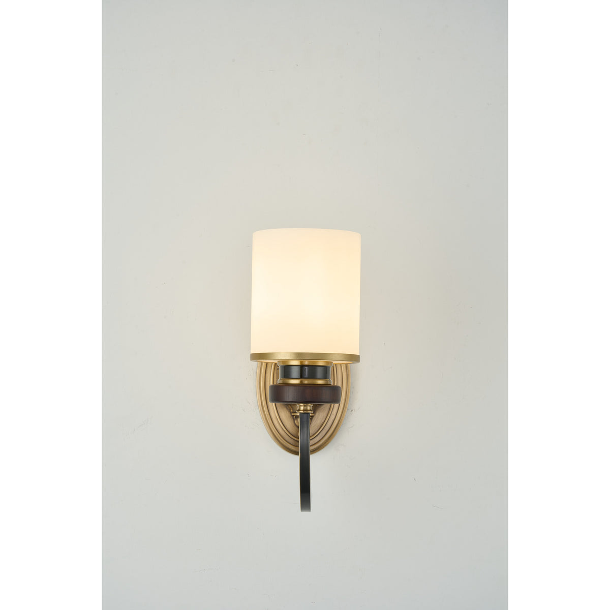 Supplier real photograph of the Ashbourne single-light wall sconce complete lit front view