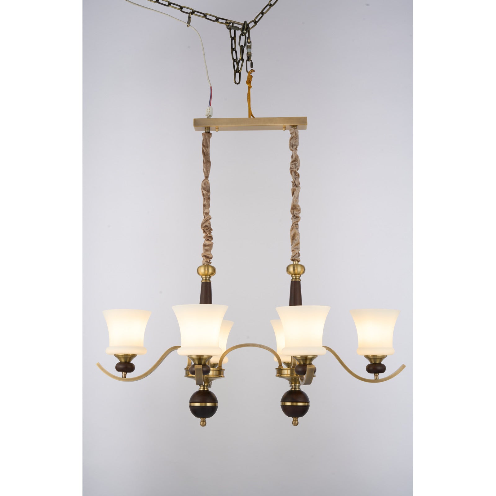 Supplier real photograph of the illuminated Brontelle six-light linear chandelier complete front view