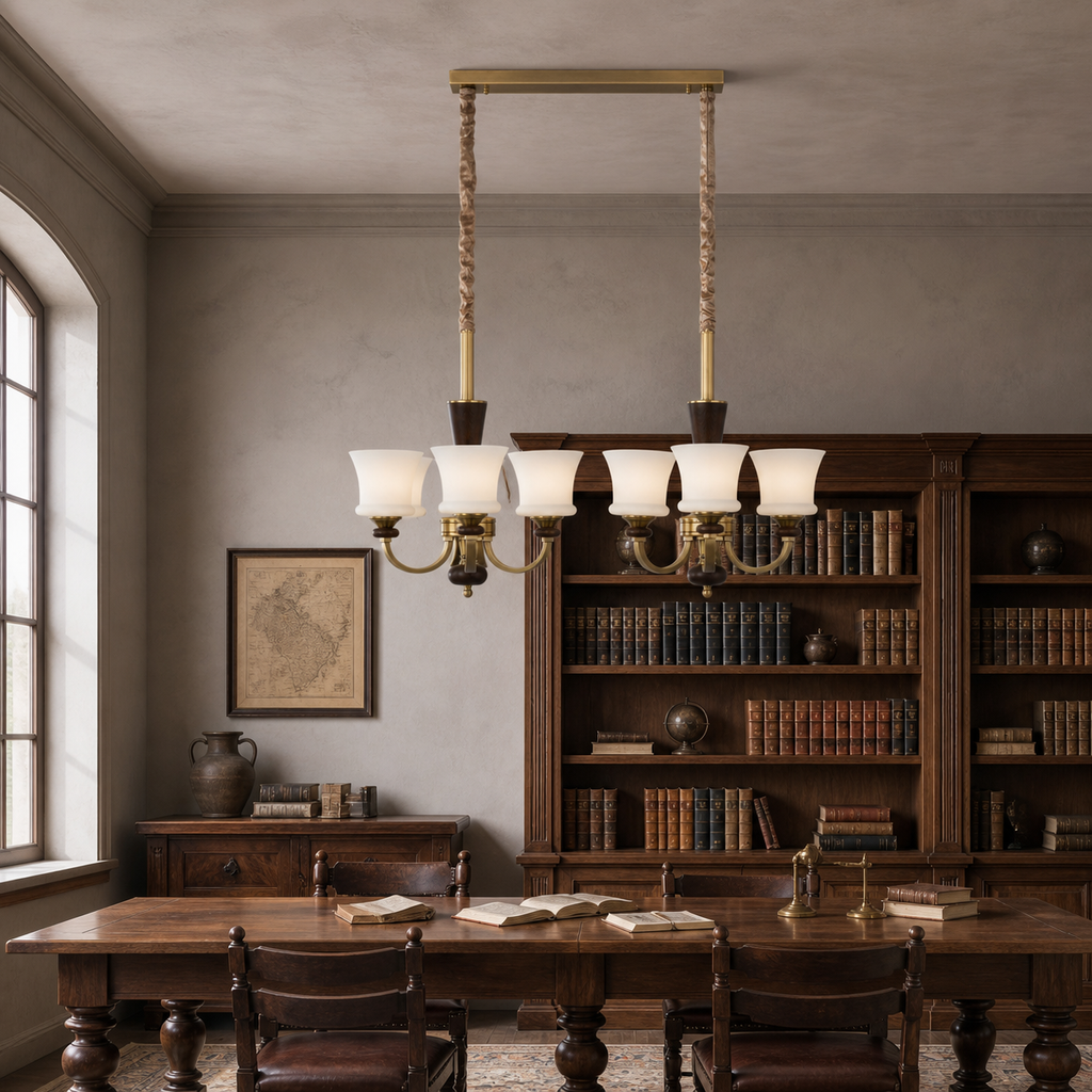 Caldrienne six-light linear chandelier unlit above a library table