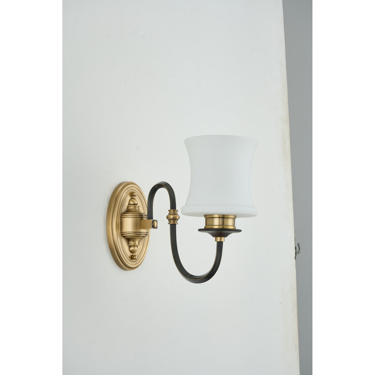 Supplier real photograph of the Ebonelle one-light wall sconce three-quarter view