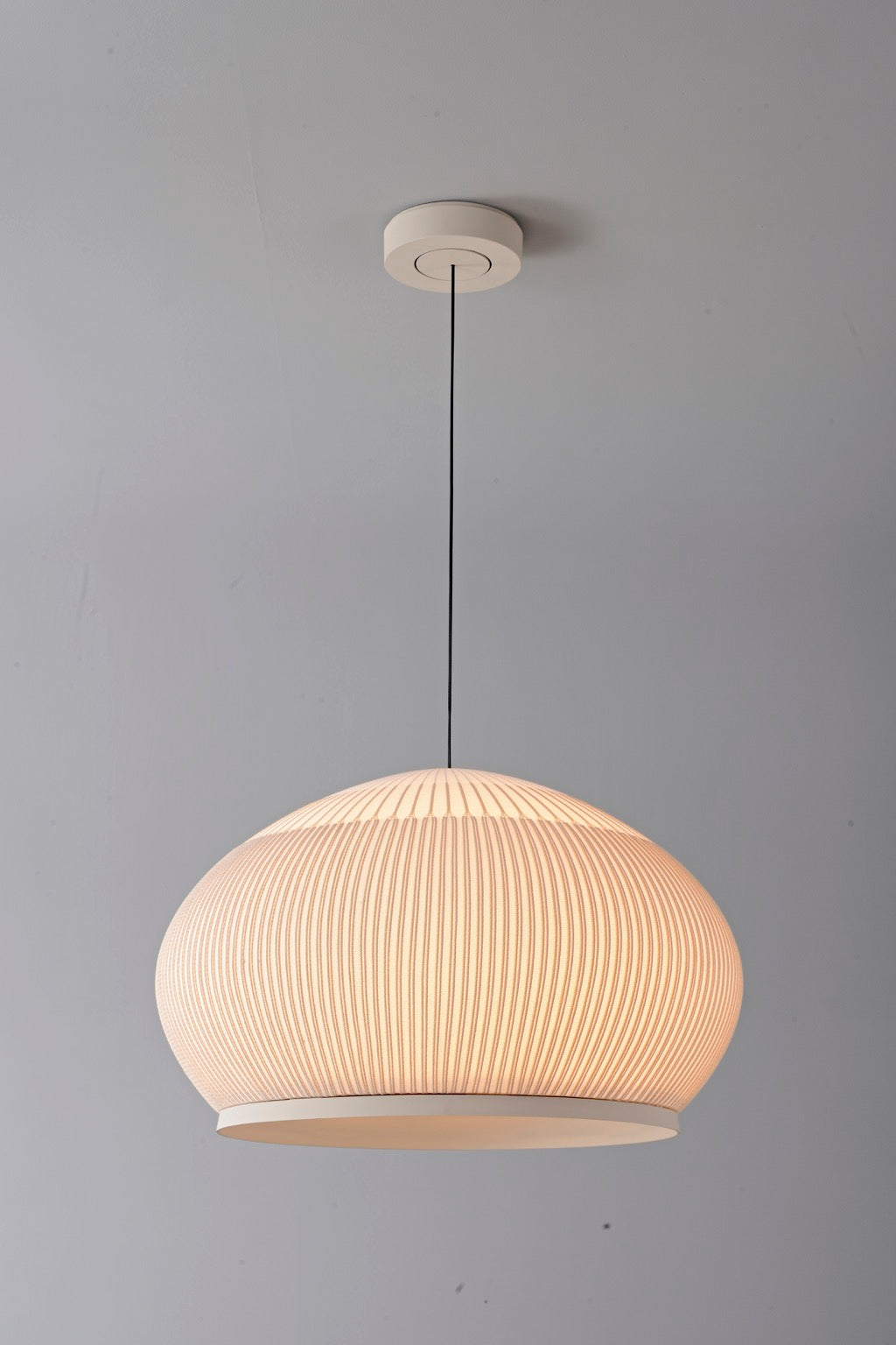 Modern Ribbed Dome Pendant Light — complete low wide shade illuminated