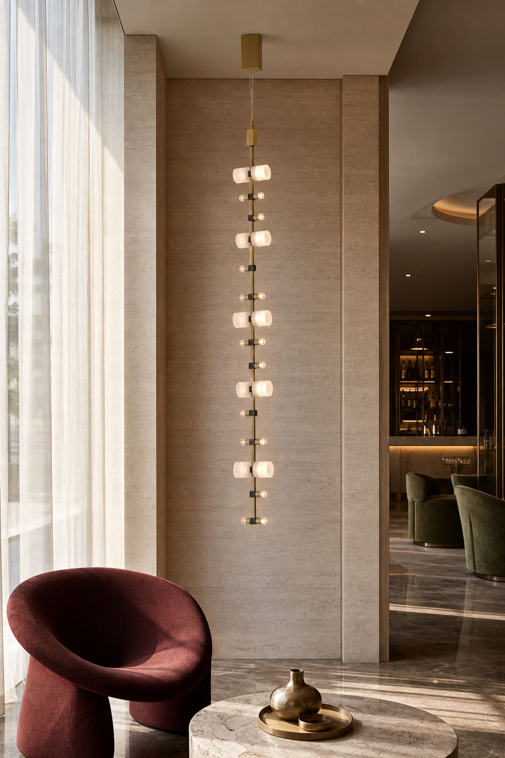 Royal vertical pendant installed in a warm boutique lobby seating area