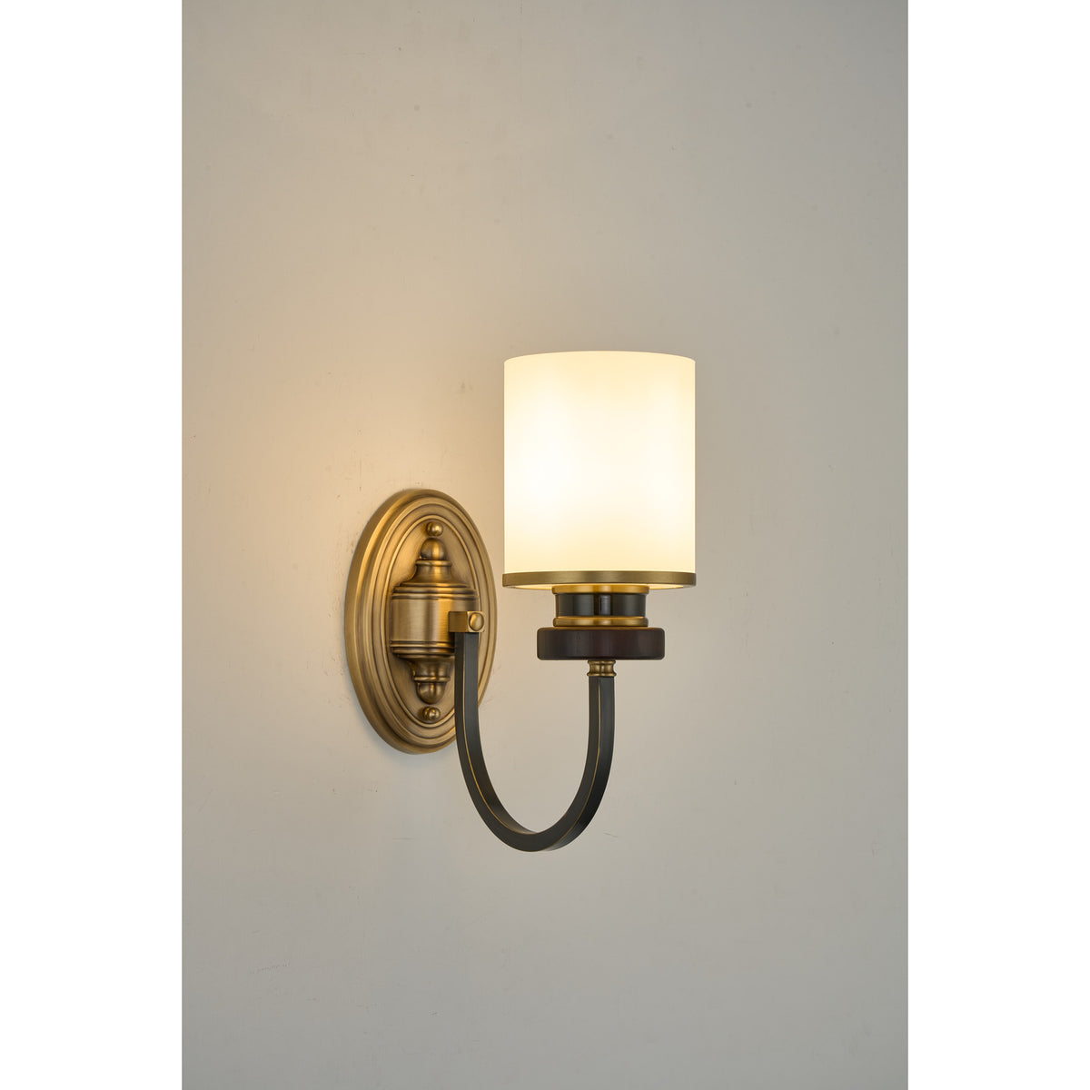 Supplier real photograph of the Ashbourne single-light wall sconce complete lit angled view