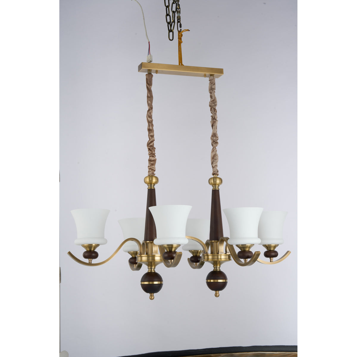Supplier real photograph of the unlit Brontelle six-light linear chandelier three-quarter view