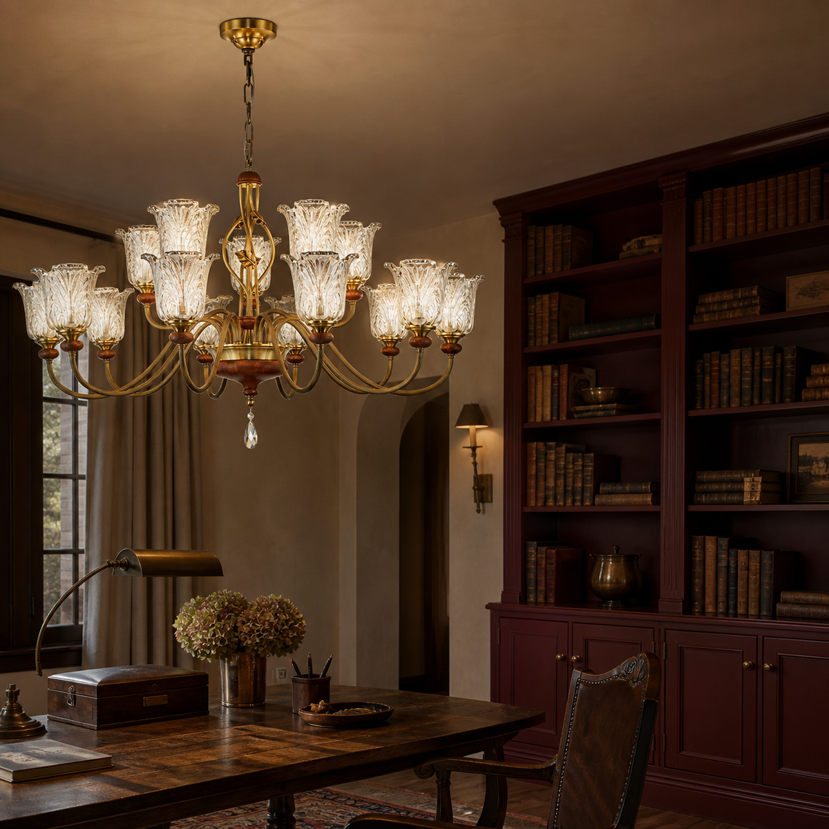 Fifteen-light ten plus five two-tier sculpted leaf glass chandelier on the left in an oxblood library