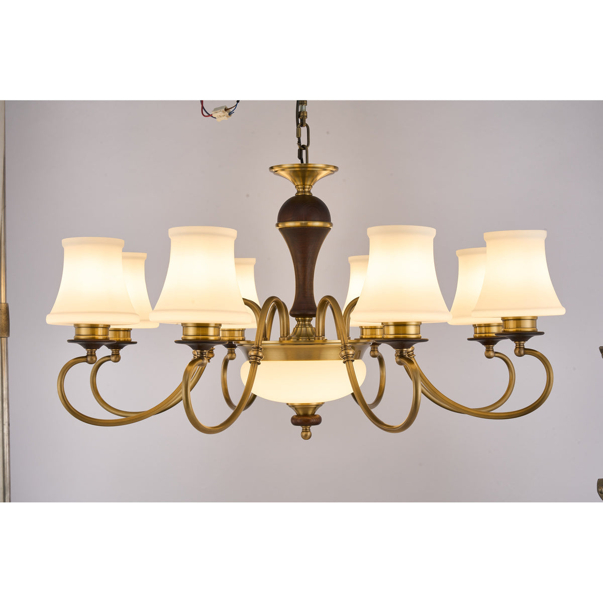 Supplier real photograph of the Glenhaven eight-light chandelier complete lit front view
