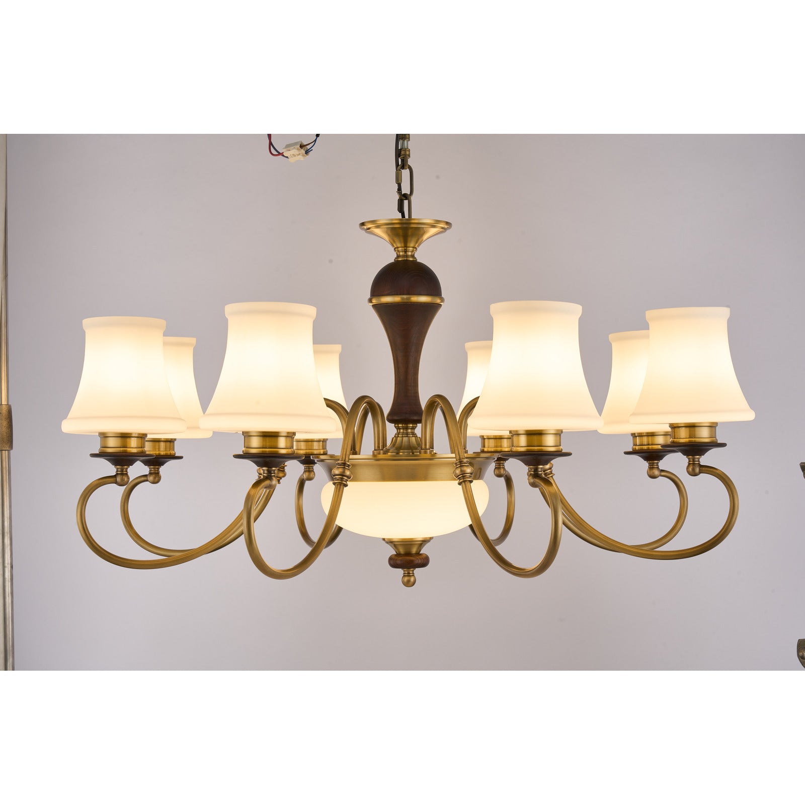 Supplier real photograph of the Glenhaven eight-light chandelier complete lit front view
