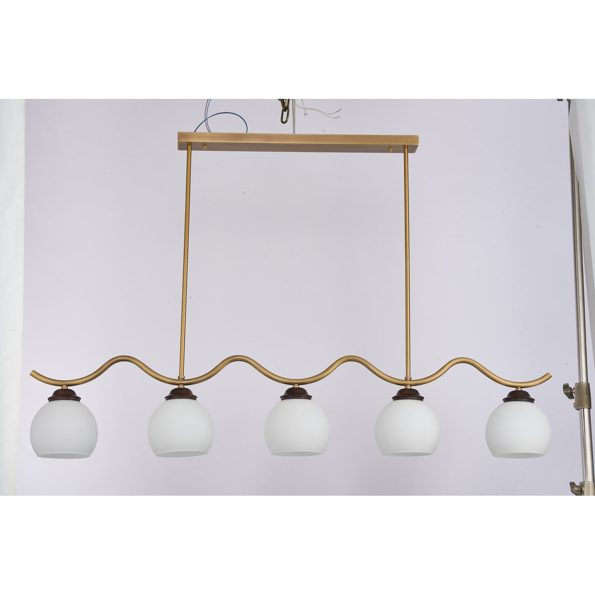 Supplier real photograph of the Ondervale five-light linear chandelier complete angled view