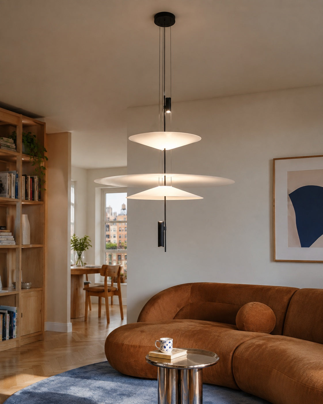 Three-tier layered acrylic disc pendant in a warm contemporary young professional home