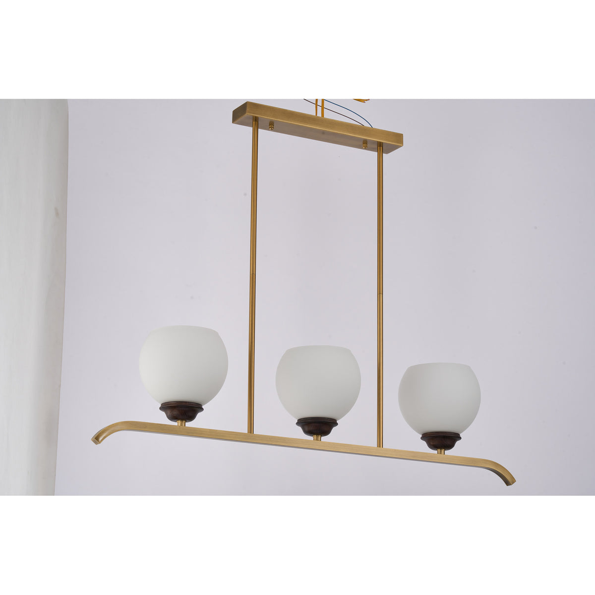 Supplier real photograph of the unlit Avelune three-light linear chandelier complete front view