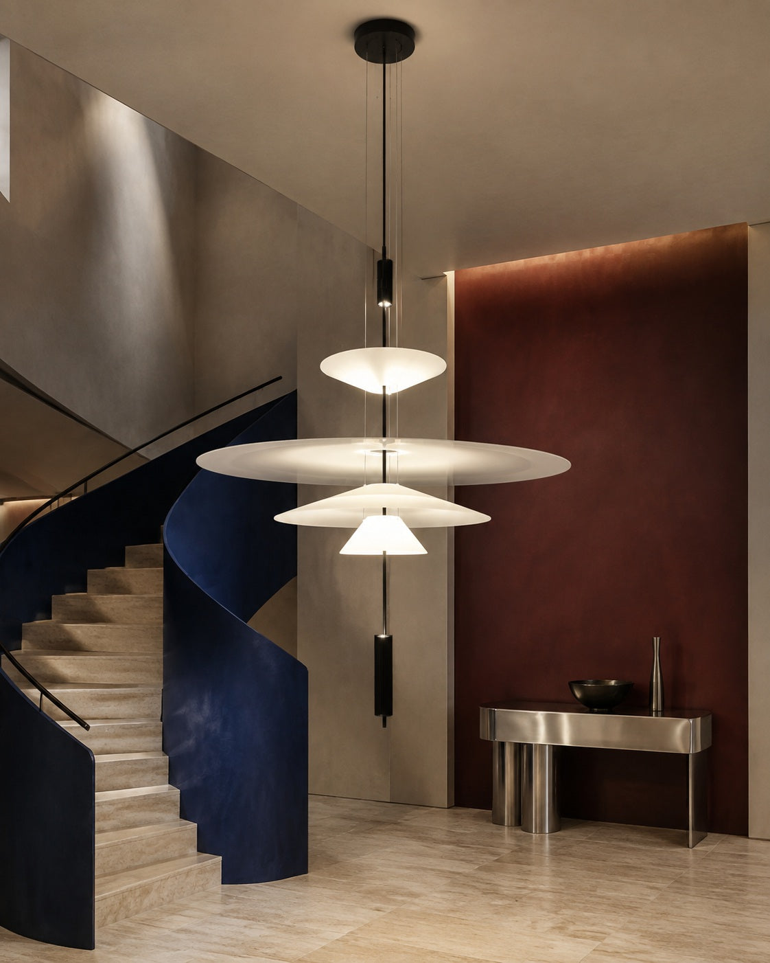 Four-tier layered acrylic disc pendant in a colorful contemporary foyer