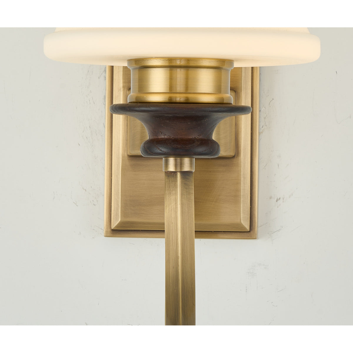 Supplier real detail photograph of the Kingswell dark ash-wood socket cup and antique-brass collar