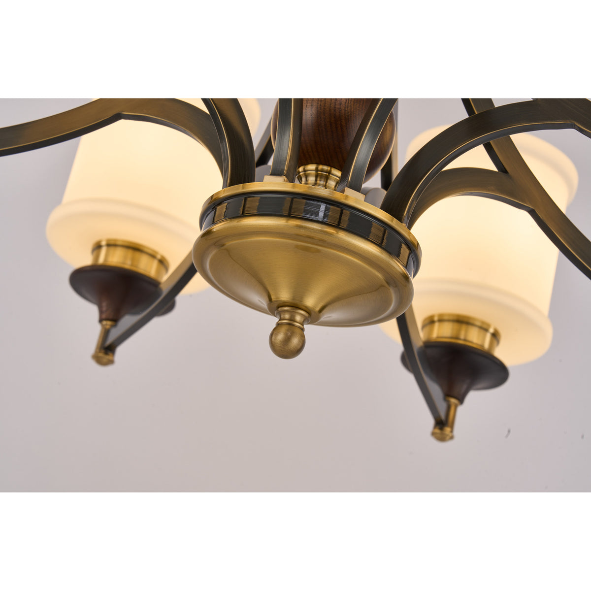 Supplier real detail photograph of the Montclair antique-brass lower bowl and dark socket cups