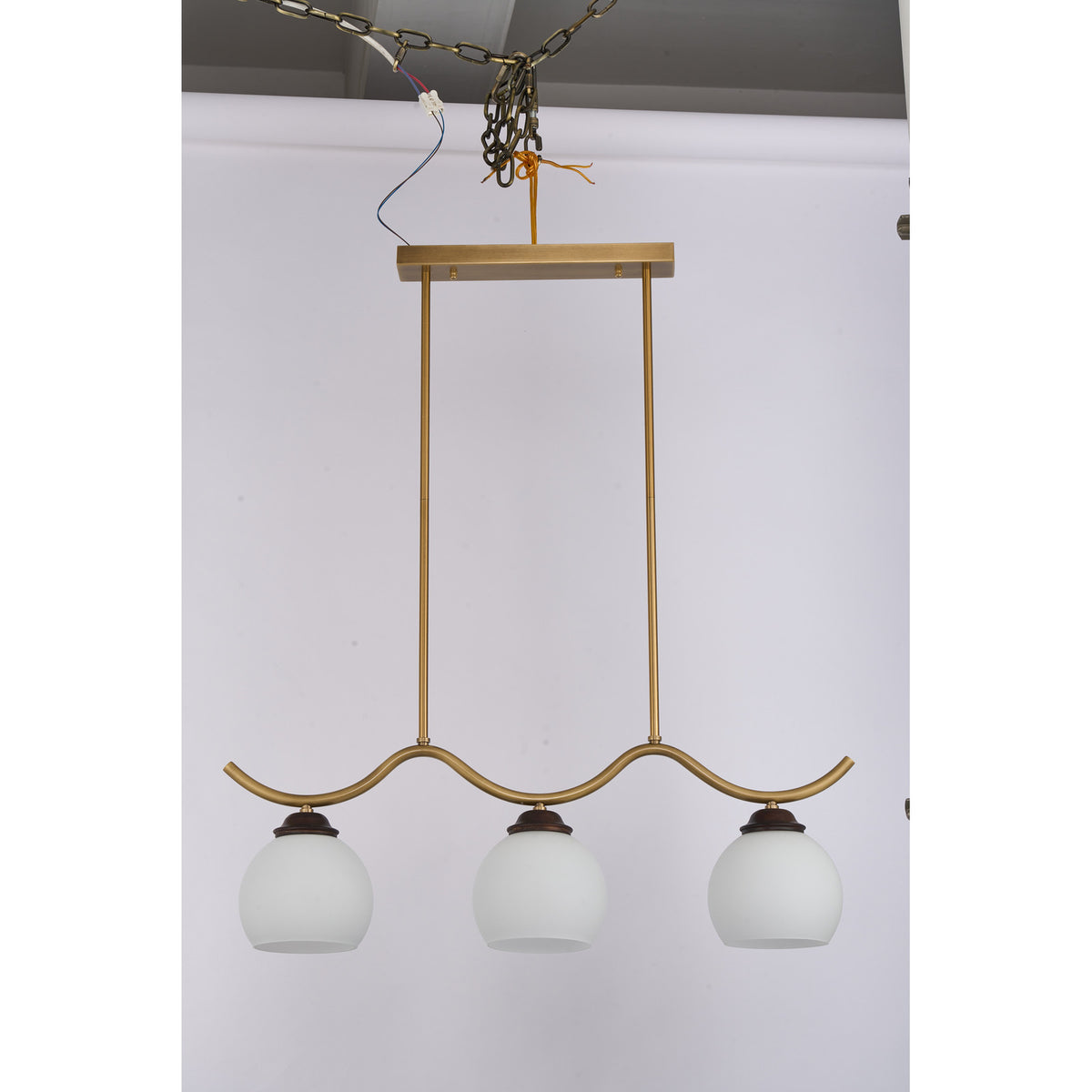 Supplier real photograph of the Ondervale three-light linear chandelier complete unlit front view