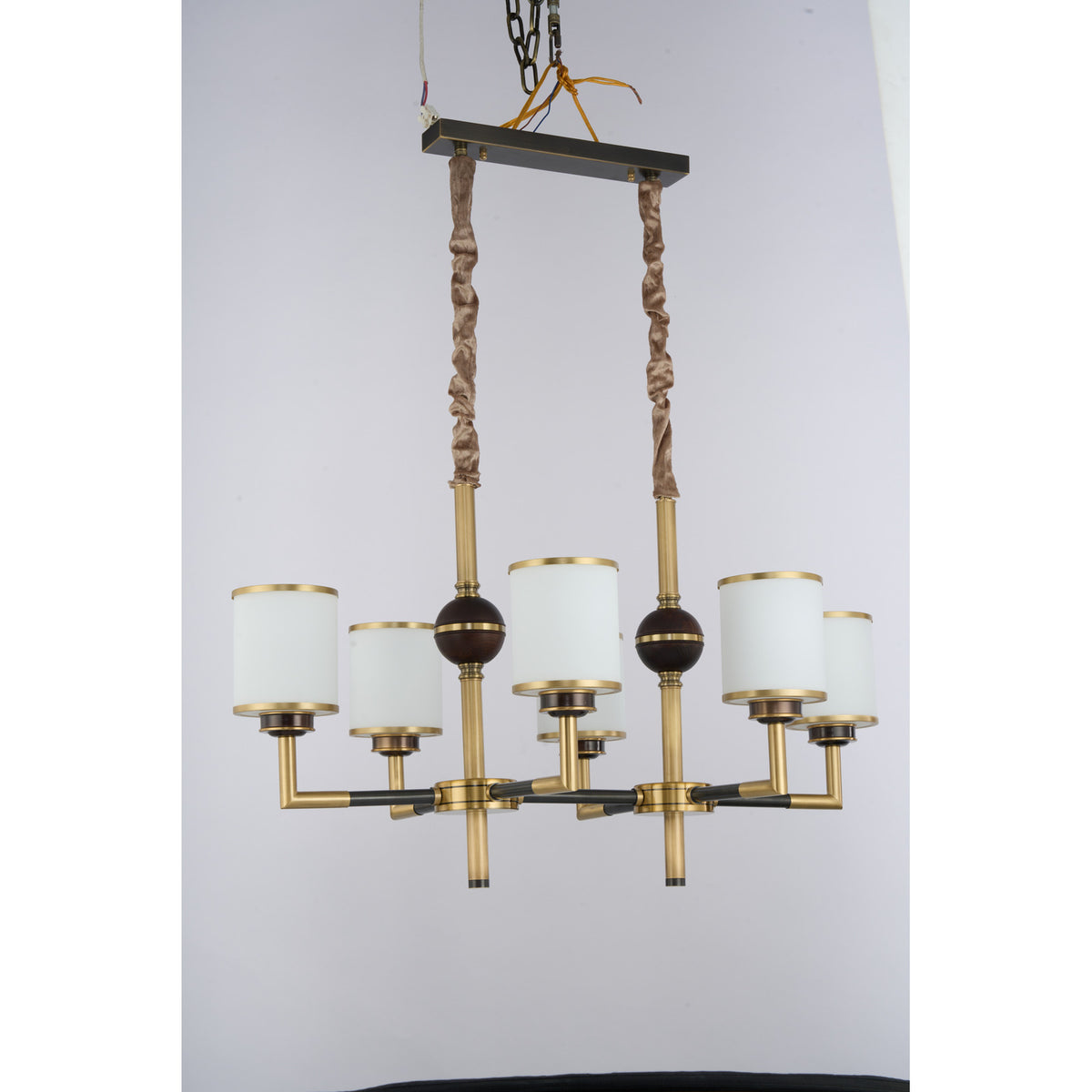 Supplier real photograph of the unlit Orseline six-light linear chandelier complete angled view