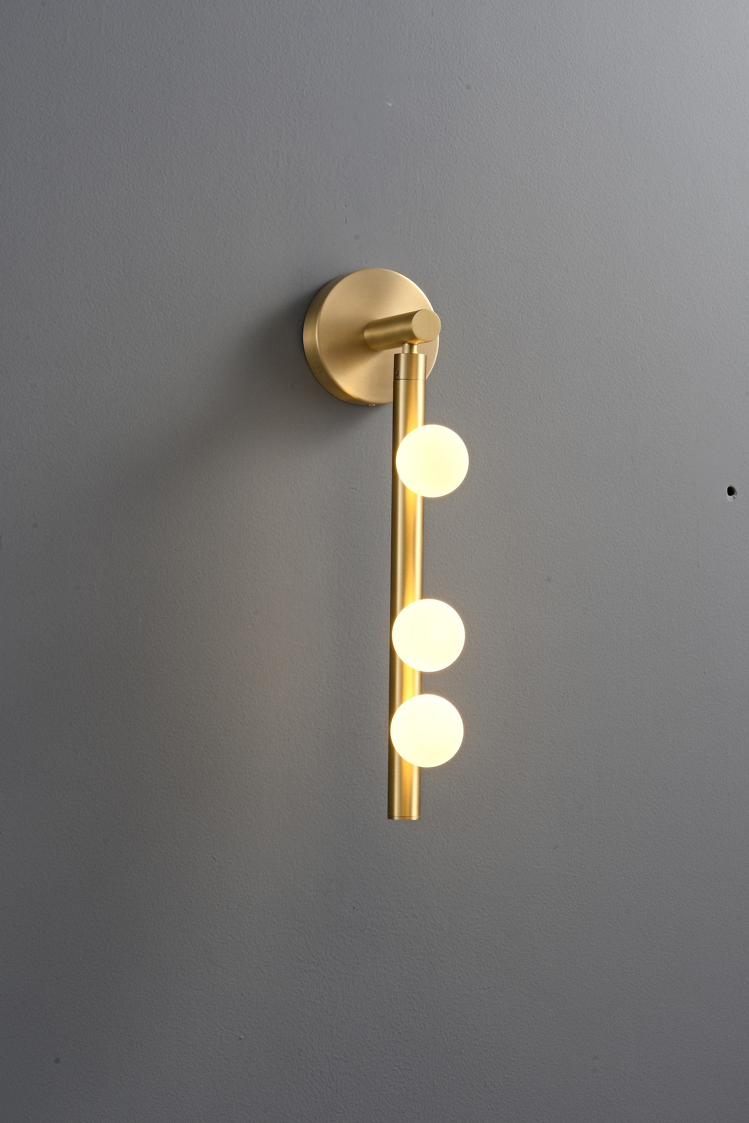 Modern Glass Globe Vertical Wall Sconce - 06 06-real-shot-brass-globe-vertical-wall-sconce-lit