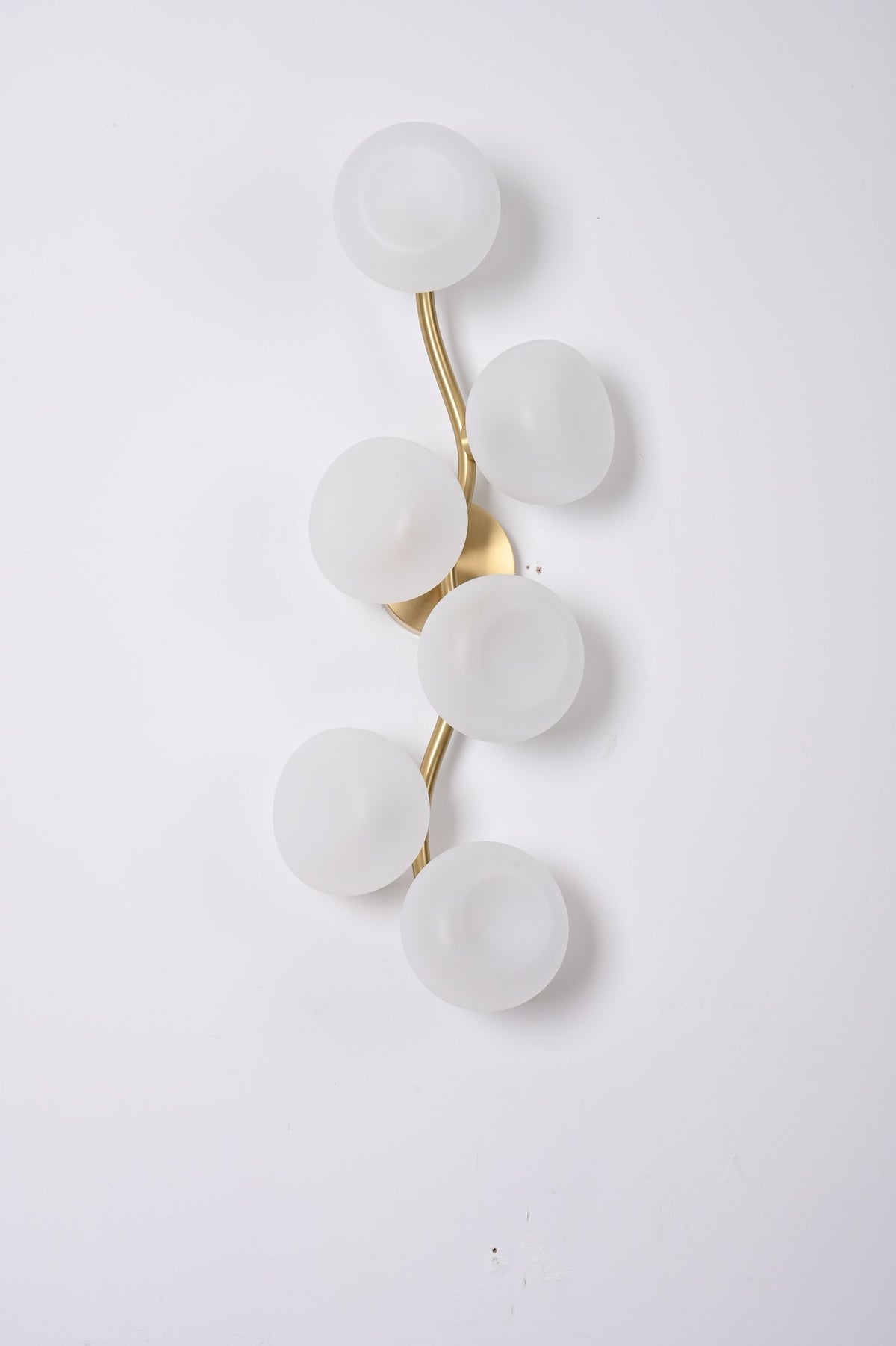 Modern Glass Globe Branch Wall Sconce in Natural Brass - 06 06-real-shot-glass-globe-wall-sconce-lit-front