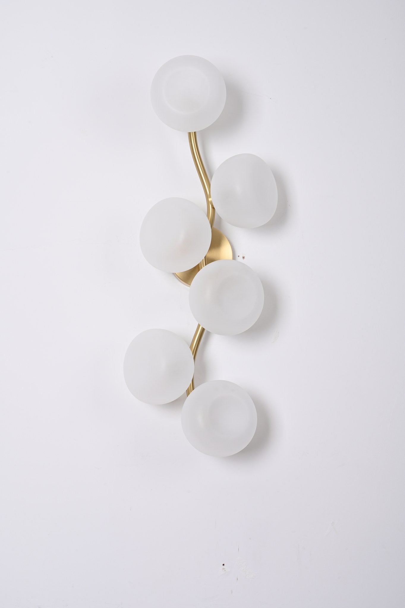 Modern Glass Globe Branch Wall Sconce in Natural Brass - 06 06-real-shot-glass-globe-wall-sconce-lit-front