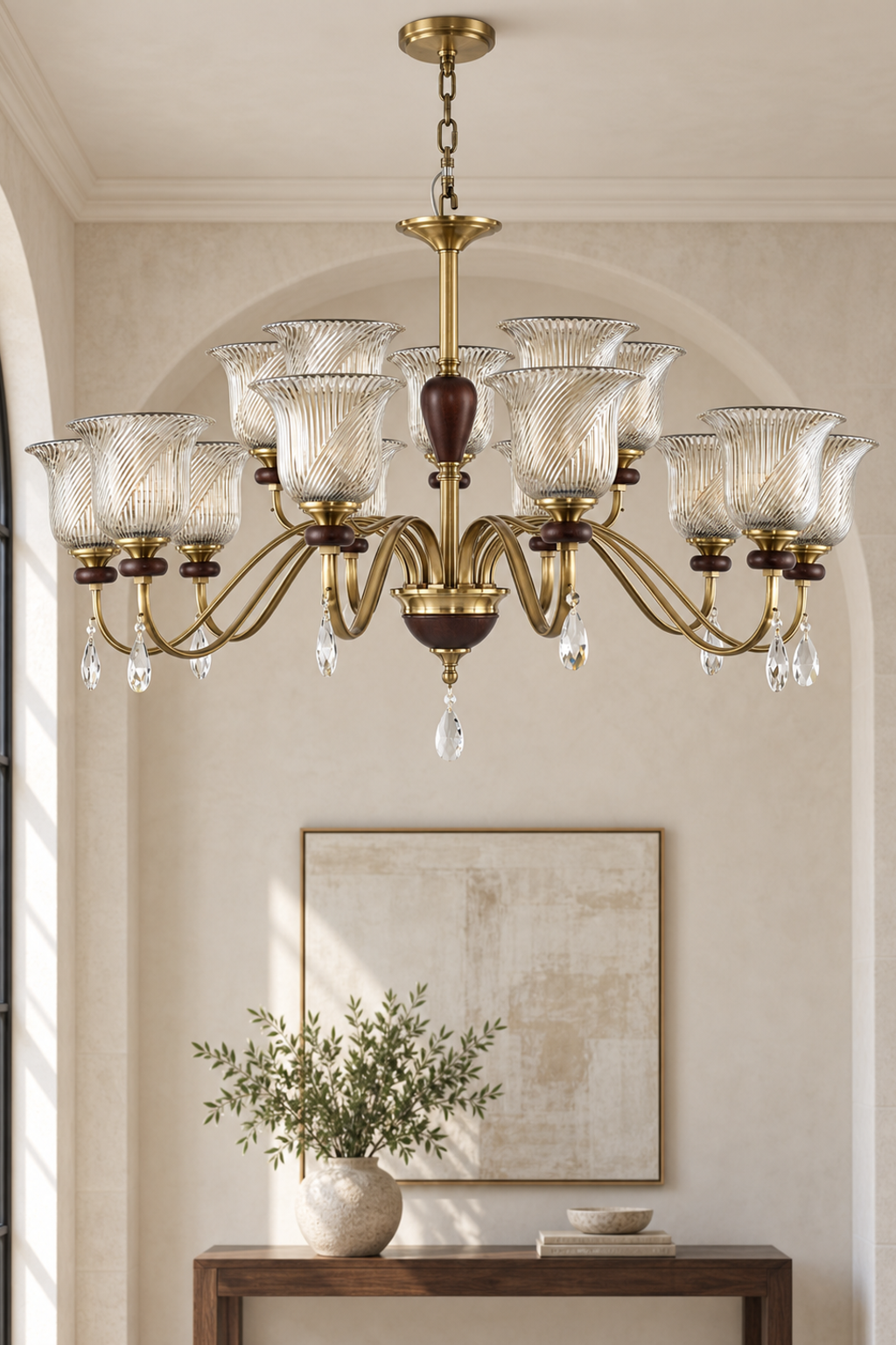 Rillavine fifteen-light two-tier chandelier centered in a tall limestone foyer, fixture off