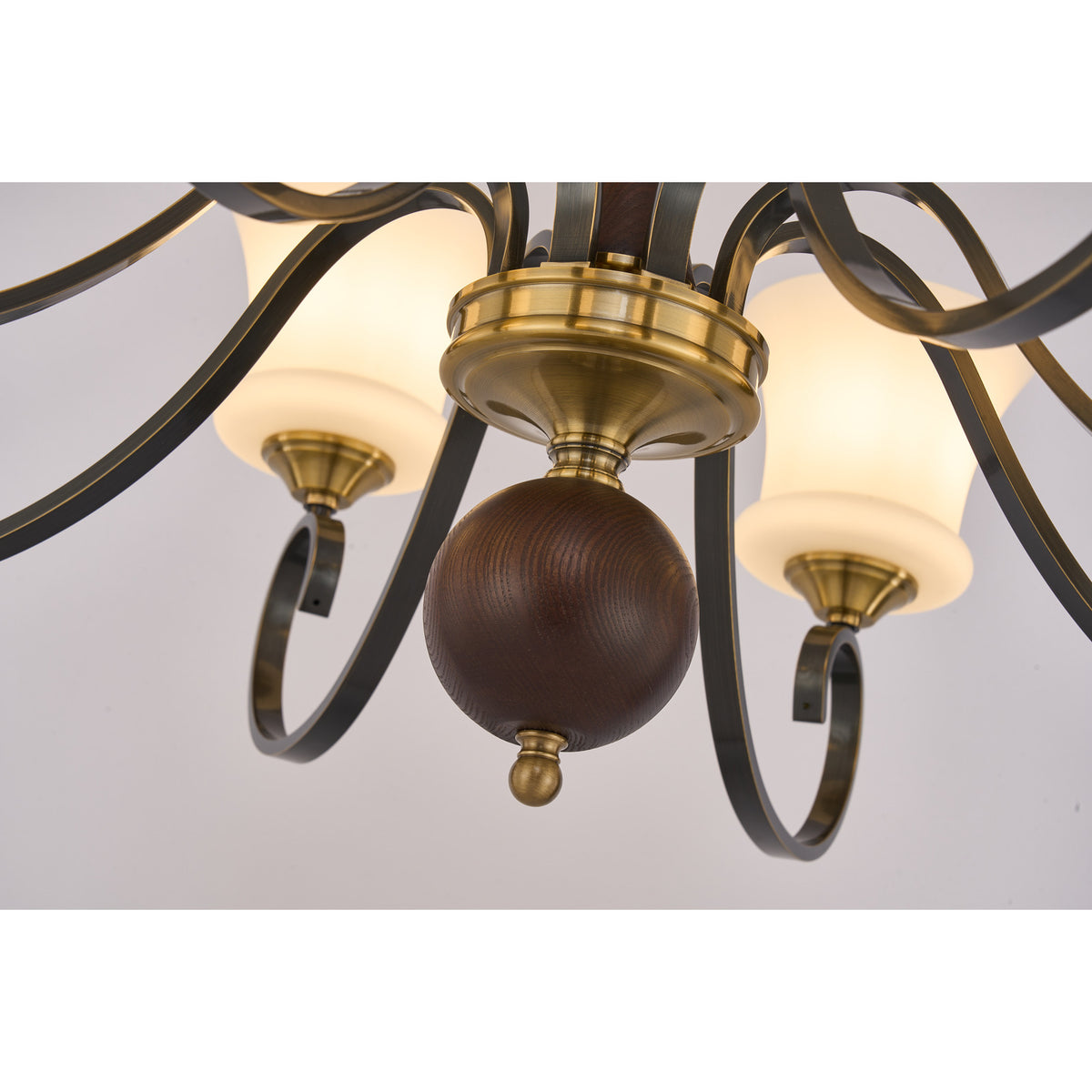 Supplier real detail photograph of the Rosethorne dark ash-wood lower sphere and brass finial
