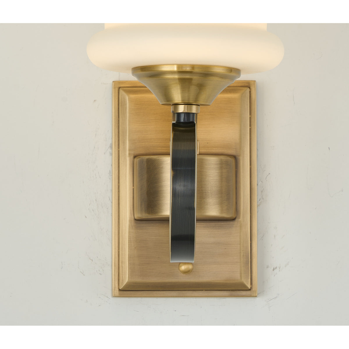 Supplier real detail photograph of the Rosethorne antique-brass socket and opal shade