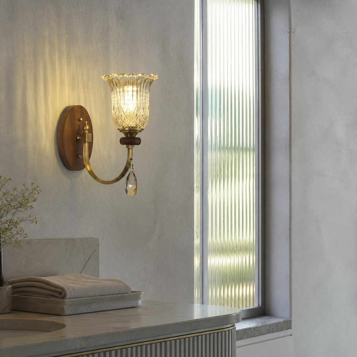 Ribbed tulip glass wall sconce in a dry silver-gray dressing area