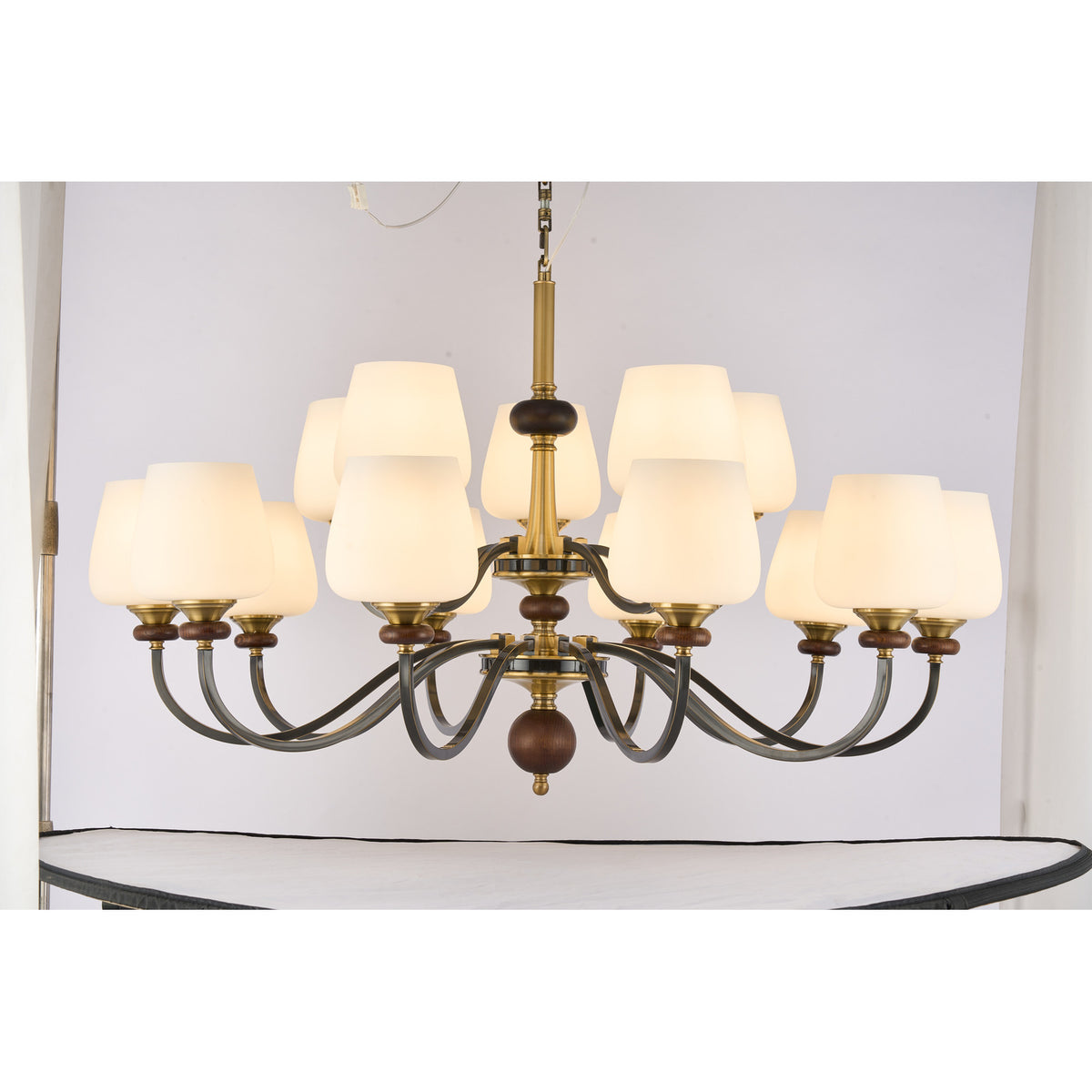 Supplier real photograph of the Wetherby twelve-light two-tier chandelier complete lit front view